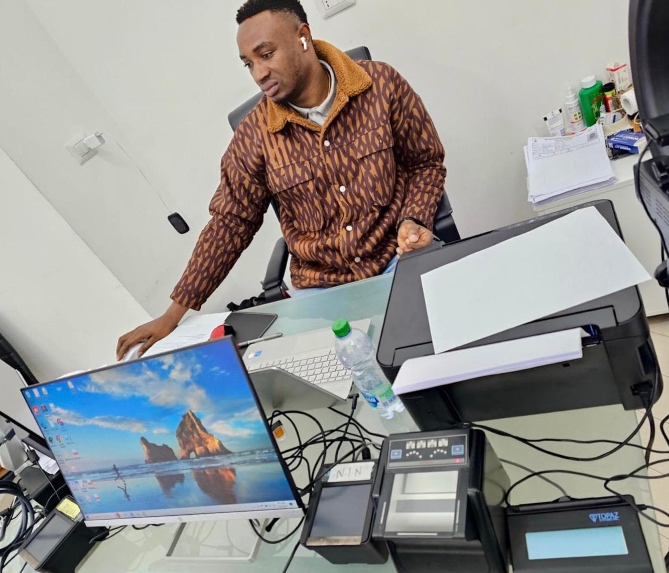 Liberty Digital Consulting Services desk with registration tools and printer setup